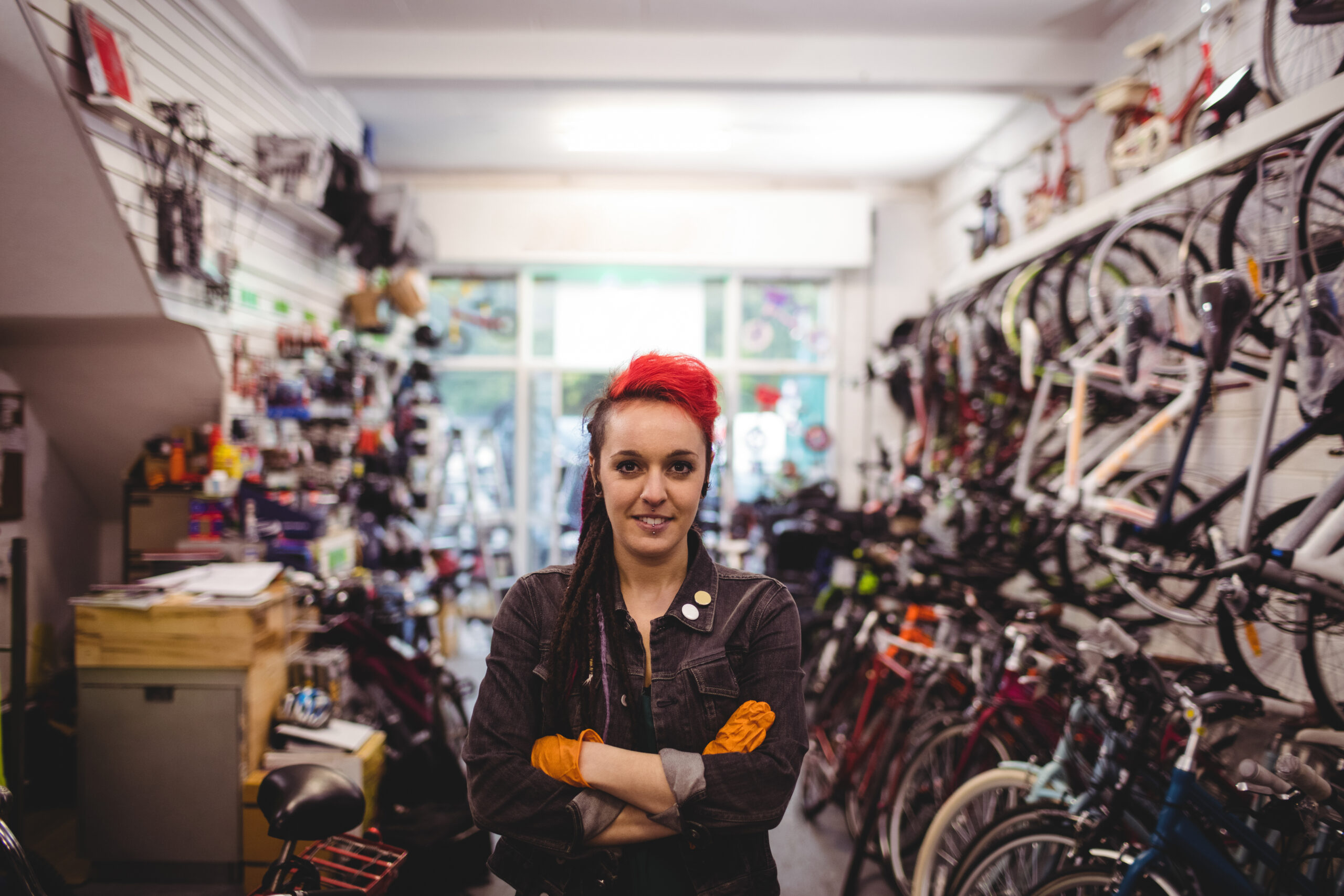 smiling mechanic standing with arms crossed